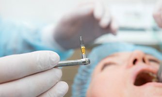 A patient undergoing dental implant surgery