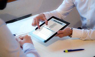 Patient reviewing dental insurance paperwork