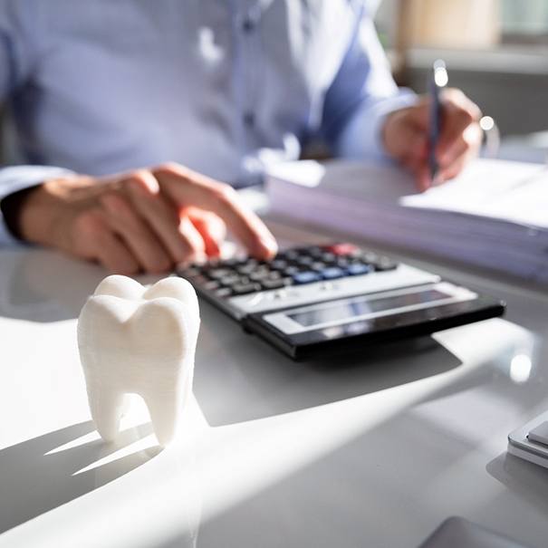 Patient calculating the cost of cosmetic dentistry in Bakersfield