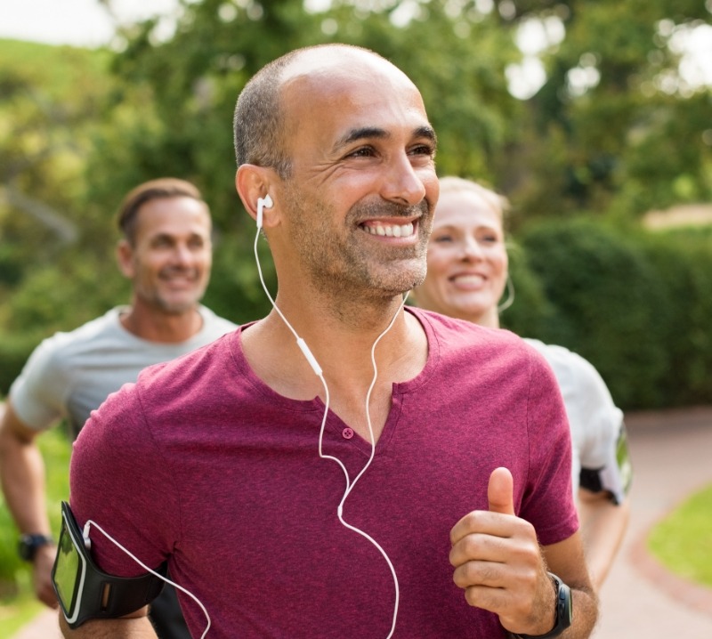 Man jogging after tooth replacement with dental implants