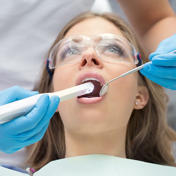 Dentist using intraoral camera to capture smile images