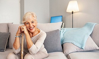 Woman happy about dentures in Bakersfield