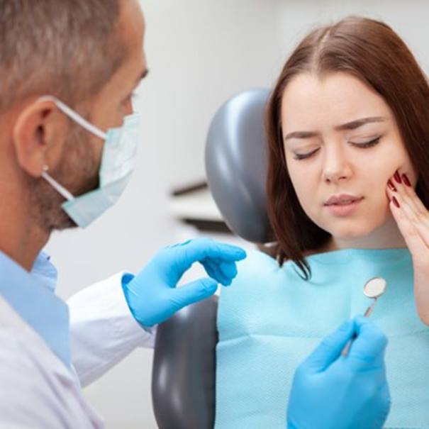 young woman talking to her emergency dentist in Bakersfield 