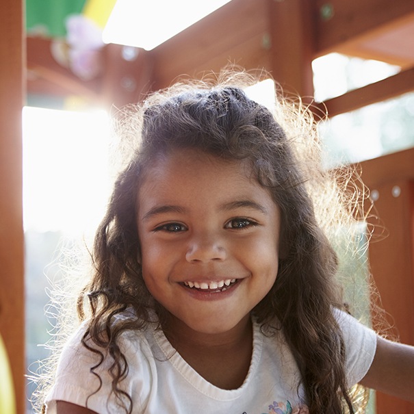 Little girl with healthy smile after children's dentistry