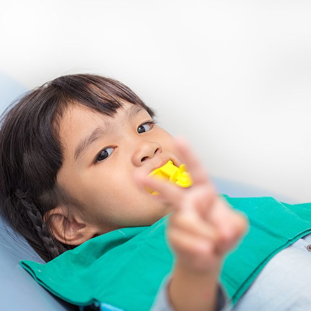 Young patient receiving fluoride treatment