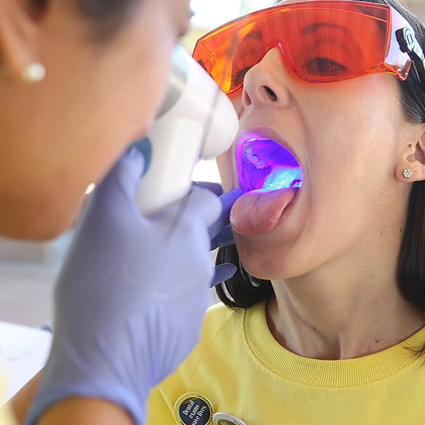 Patient receiving oral cancer screening