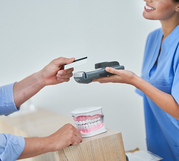  A man verifying his Guardian Dental Insurance coverage.