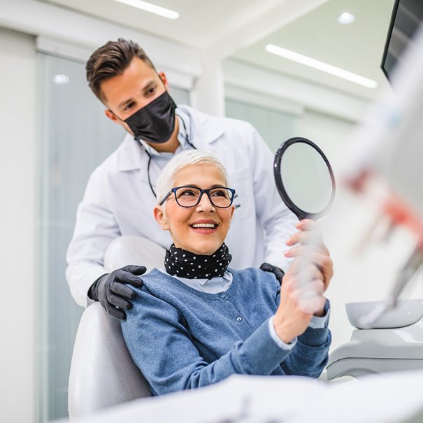  A man paying for his dental treatment.