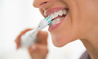 Woman brushing her teeth