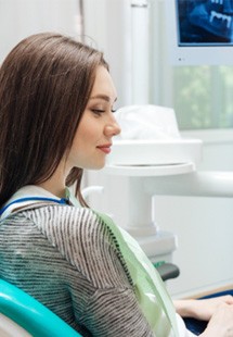 dentist explaining dental implants to patient 