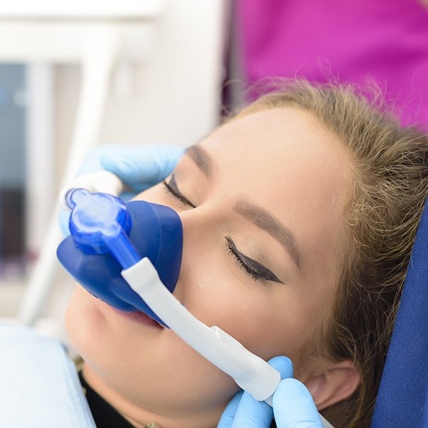 Woman with nitrous oxide dental sedation mask