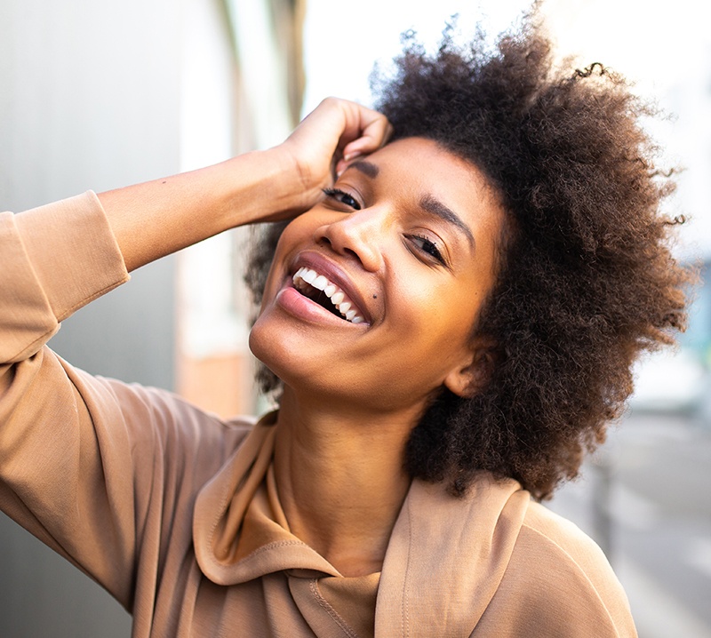 Woman with gorgeous smile after porcelain veneers