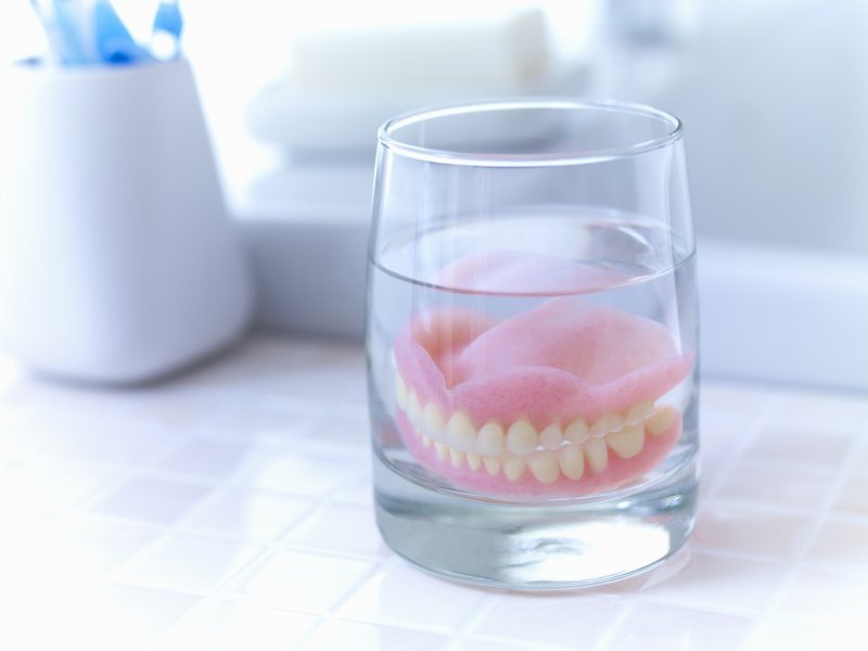 dentures soaking in water