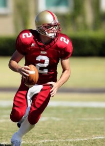 Football player in red uniform