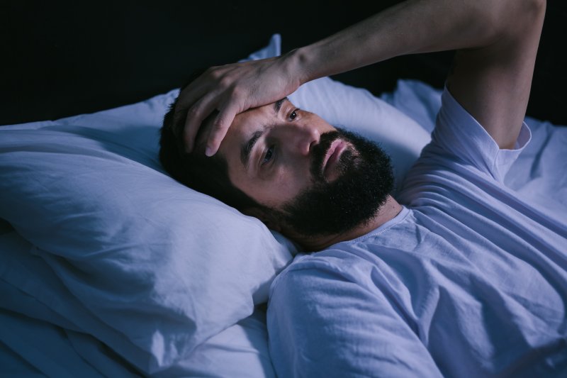 Patient trying to sleep with tooth pain