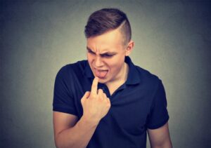 Man with a bitter taste in mouth